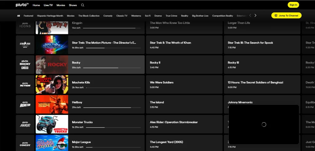 Pluto TV live channel guide grid displaying movie channels and showtimes, including Rocky, Star Trek, Hellboy, and Kingpin, with category tabs for Movies, Comedy, and Classic TV